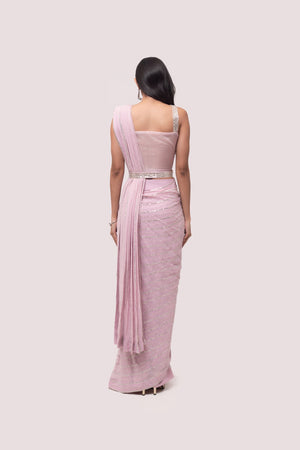 Shop stunning powder pink embroidered drape saree online in USA with blouse. Look your best at parties and weddings in beautiful designer sarees, embroidered sarees, handwoven sarees, silk sarees, organza saris from Pure Elegance Indian saree store in USA.-back