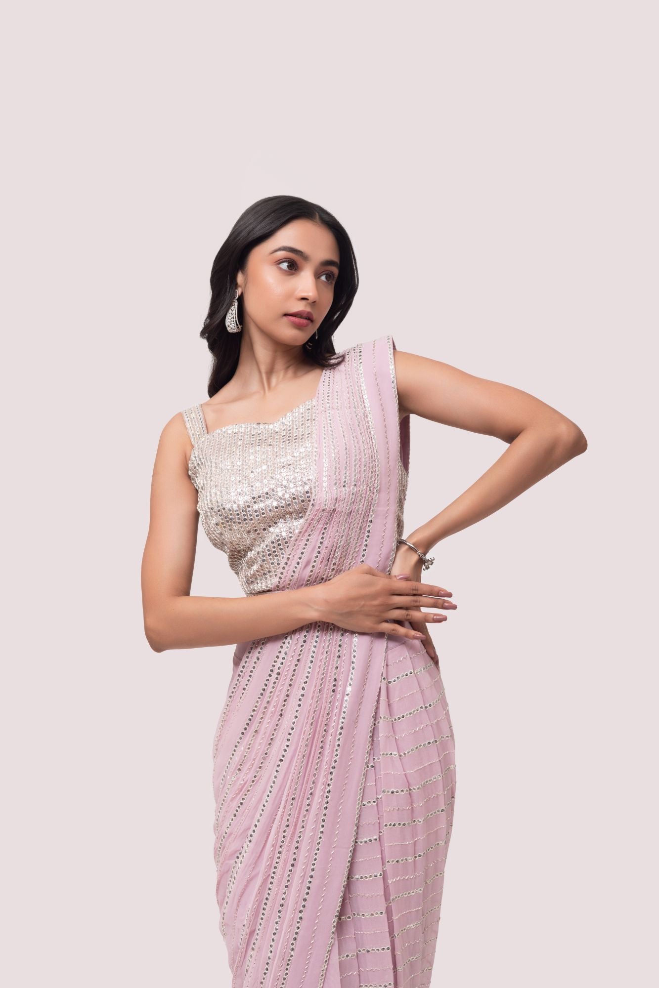 Shop stunning powder pink embroidered drape saree online in USA with blouse. Look your best at parties and weddings in beautiful designer sarees, embroidered sarees, handwoven sarees, silk sarees, organza saris from Pure Elegance Indian saree store in USA.-closeup