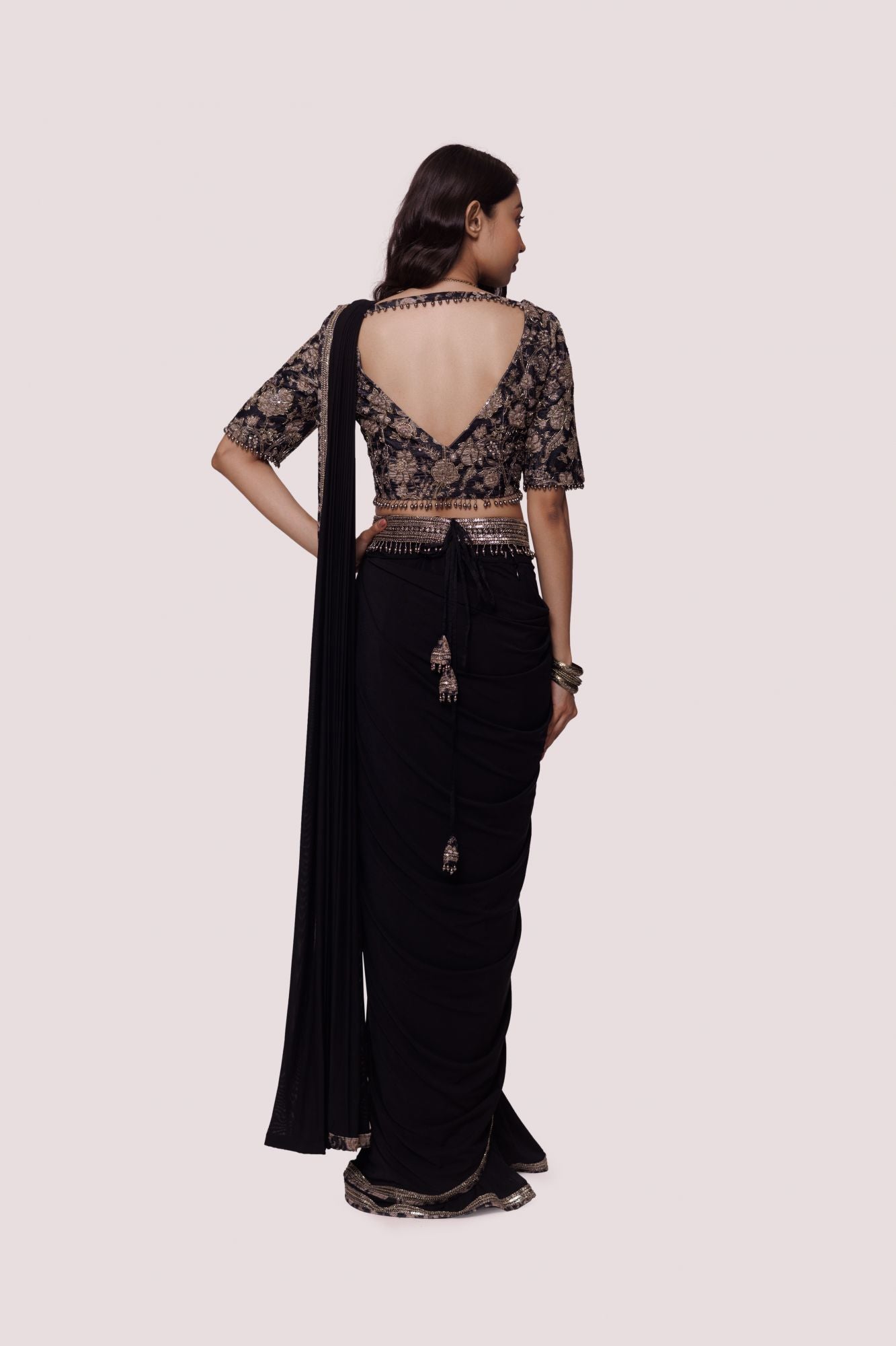 Buy beautiful black lycra net drape saree online in USA with embroidered velvet blouse. Look your best at parties and weddings in beautiful designer sarees, embroidered sarees, handwoven sarees, silk sarees, organza saris from Pure Elegance Indian saree store in USA.-back