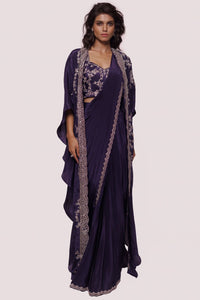 Buy beautiful purple embellished crepe saree online in USA with embroidered cape. Look your best at parties and weddings in beautiful designer sarees, embroidered sarees, handwoven sarees, silk sarees, organza saris from Pure Elegance Indian saree store in USA.-full view