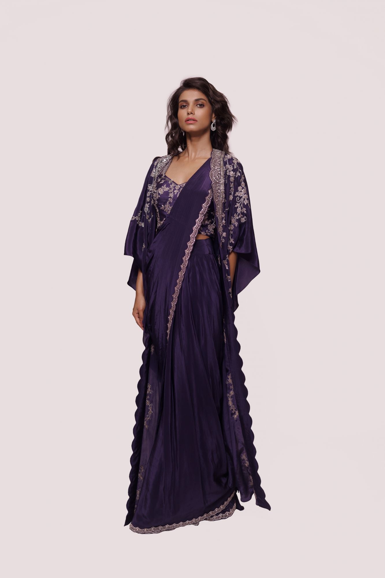 Buy beautiful purple embellished crepe saree online in USA with embroidered cape. Look your best at parties and weddings in beautiful designer sarees, embroidered sarees, handwoven sarees, silk sarees, organza saris from Pure Elegance Indian saree store in USA.-saree