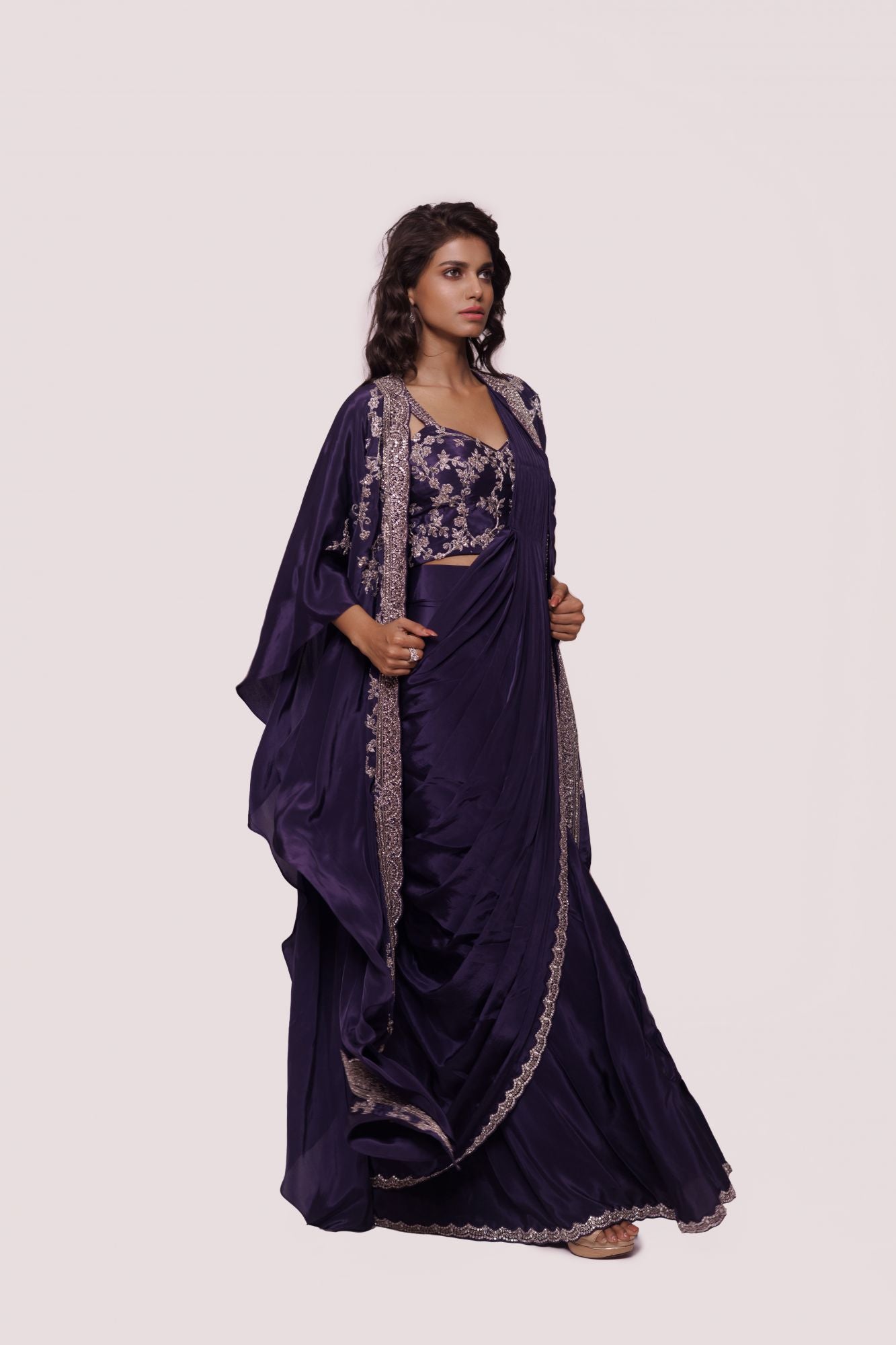 Buy beautiful purple embellished crepe saree online in USA with embroidered cape. Look your best at parties and weddings in beautiful designer sarees, embroidered sarees, handwoven sarees, silk sarees, organza saris from Pure Elegance Indian saree store in USA.-side