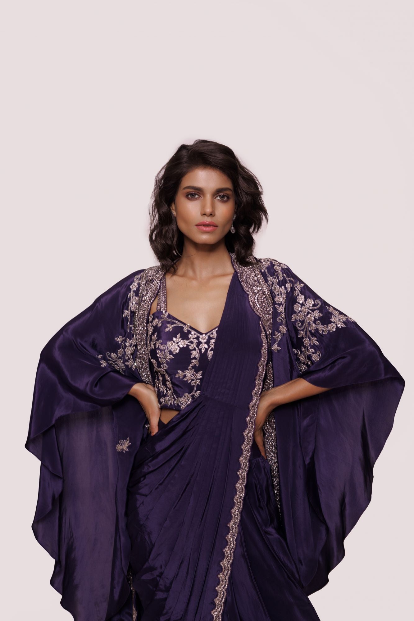 Buy beautiful purple embellished crepe saree online in USA with embroidered cape. Look your best at parties and weddings in beautiful designer sarees, embroidered sarees, handwoven sarees, silk sarees, organza saris from Pure Elegance Indian saree store in USA.-closeup