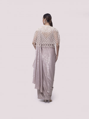 Buy beautiful onion pink shimmer drape lycra saree gown online in USA. Look your best at parties and weddings in beautiful designer sarees, embroidered sarees, handwoven sarees, silk sarees, organza saris from Pure Elegance Indian saree store in USA.-back