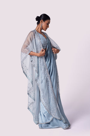 Shop stunning doctor blue lycra drape saree online in USA with cape. Look your best at parties and weddings in beautiful designer sarees, embroidered sarees, handwoven sarees, silk sarees, organza saris from Pure Elegance Indian saree store in USA.-side