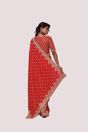 Buy red zardozi work tussar silk saree online in USA with blouse. Look your best at parties and weddings in beautiful designer sarees, embroidered sarees, handwoven sarees, silk sarees, organza saris from Pure Elegance Indian saree store in USA.-back
