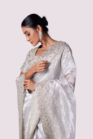 Shop beautiful steel grey embroidered tissue saree online in USA with blouse. Look your best at parties and weddings in beautiful designer sarees, embroidered sarees, handwoven sarees, silk sarees, organza saris from Pure Elegance Indian saree store in USA.-closeup