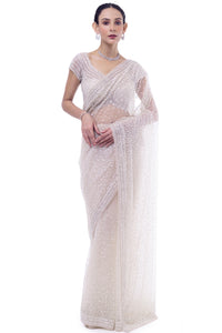 Shop off-white embroidered net saree online in USA with blouse. Look your best at parties and weddings in beautiful designer sarees, embroidered sarees, handwoven sarees, silk sarees, organza saris from Pure Elegance Indian saree store in USA.-full view