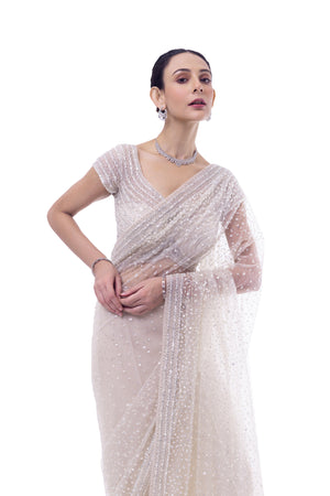 Shop off-white embroidered net saree online in USA with blouse. Look your best at parties and weddings in beautiful designer sarees, embroidered sarees, handwoven sarees, silk sarees, organza saris from Pure Elegance Indian saree store in USA.-closeup