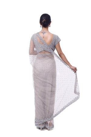 Shop beautiful light grey embroidered net saree online in USA with blouse. Look your best at parties and weddings in beautiful designer sarees, embroidered sarees, handwoven sarees, silk sarees, organza saris from Pure Elegance Indian saree store in USA.-back