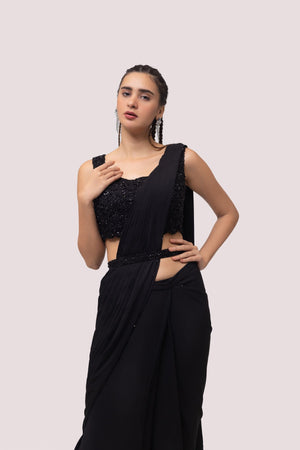 Shop black pre-draped georgette saree online in USA with soft ruffles. Look your best at parties and weddings in beautiful designer sarees, embroidered sarees, handwoven sarees, silk sarees, organza saris from Pure Elegance Indian saree store in USA.-closeup