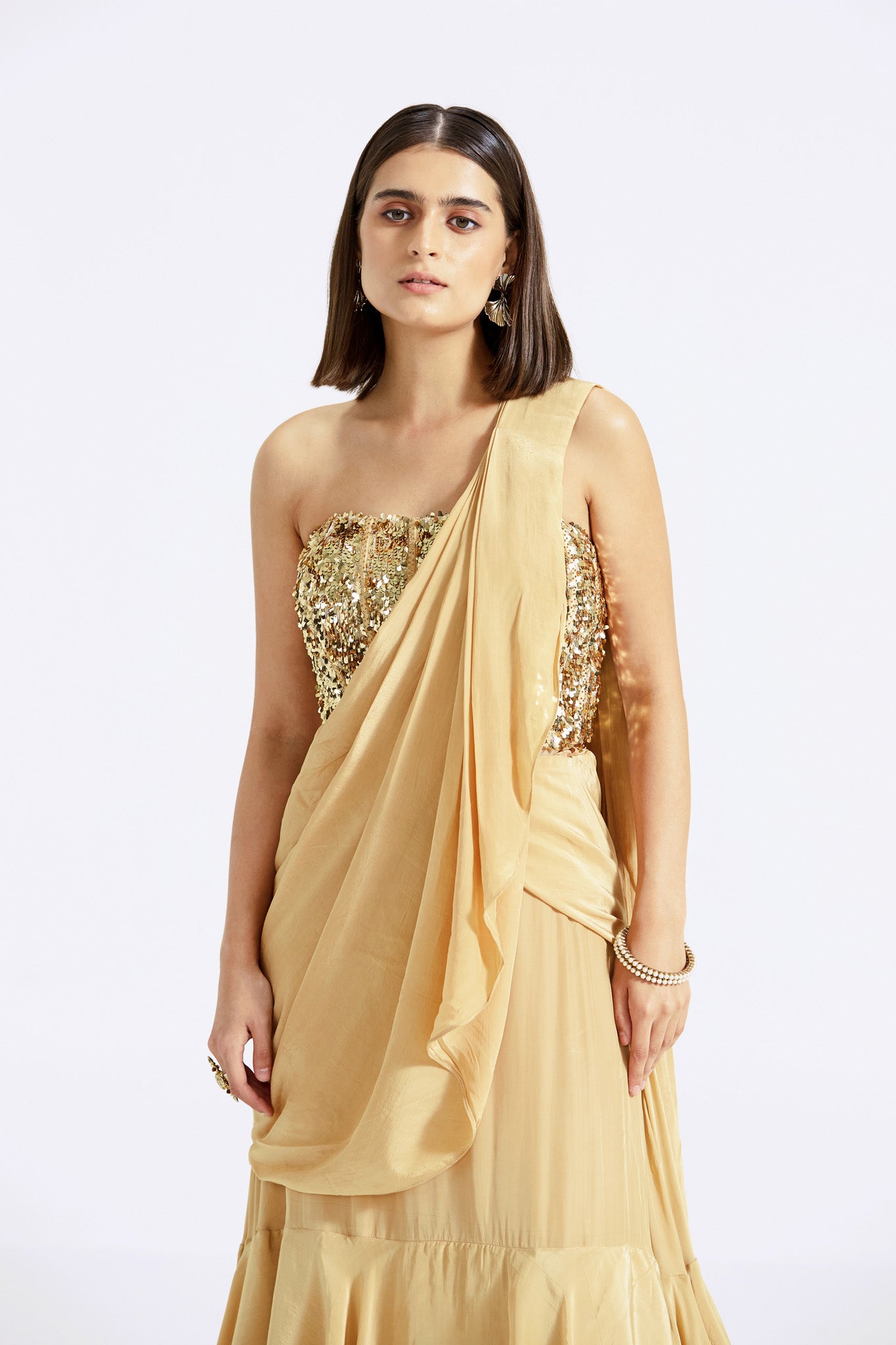 Buy gold georgette pre-draped saree online in USA with sequin blouse. Look your best at parties and weddings in beautiful designer sarees, embroidered sarees, handwoven sarees, silk sarees, organza saris from Pure Elegance Indian saree store in USA.-closeup