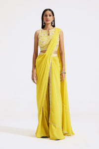 Shop yellow draped sharara saree online in USA with embroidered blouse. Look your best at parties and weddings in beautiful designer sarees, embroidered sarees, handwoven sarees, silk sarees, organza saris from Pure Elegance Indian saree store in USA.-full view