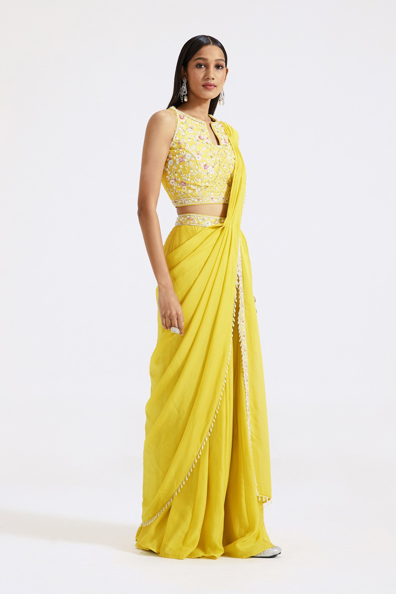 Shop yellow draped sharara saree online in USA with embroidered blouse. Look your best at parties and weddings in beautiful designer sarees, embroidered sarees, handwoven sarees, silk sarees, organza saris from Pure Elegance Indian saree store in USA.-side