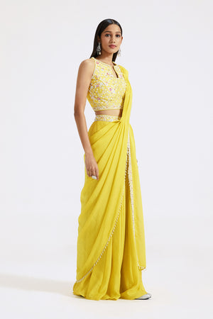 Shop yellow draped sharara saree online in USA with embroidered blouse. Look your best at parties and weddings in beautiful designer sarees, embroidered sarees, handwoven sarees, silk sarees, organza saris from Pure Elegance Indian saree store in USA.-side