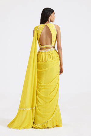 Shop yellow draped sharara saree online in USA with embroidered blouse. Look your best at parties and weddings in beautiful designer sarees, embroidered sarees, handwoven sarees, silk sarees, organza saris from Pure Elegance Indian saree store in USA.-back