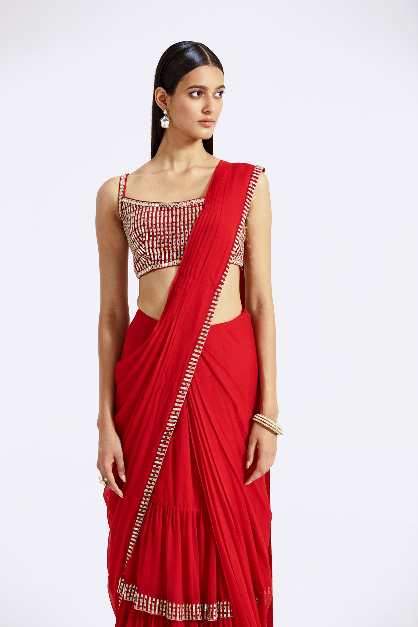 Buy red mirror work georgette pre-draped saree online in USA with embroidered blouse. Look your best at parties and weddings in beautiful designer sarees, embroidered sarees, handwoven sarees, silk sarees, organza saris from Pure Elegance Indian saree store in USA.-closeup