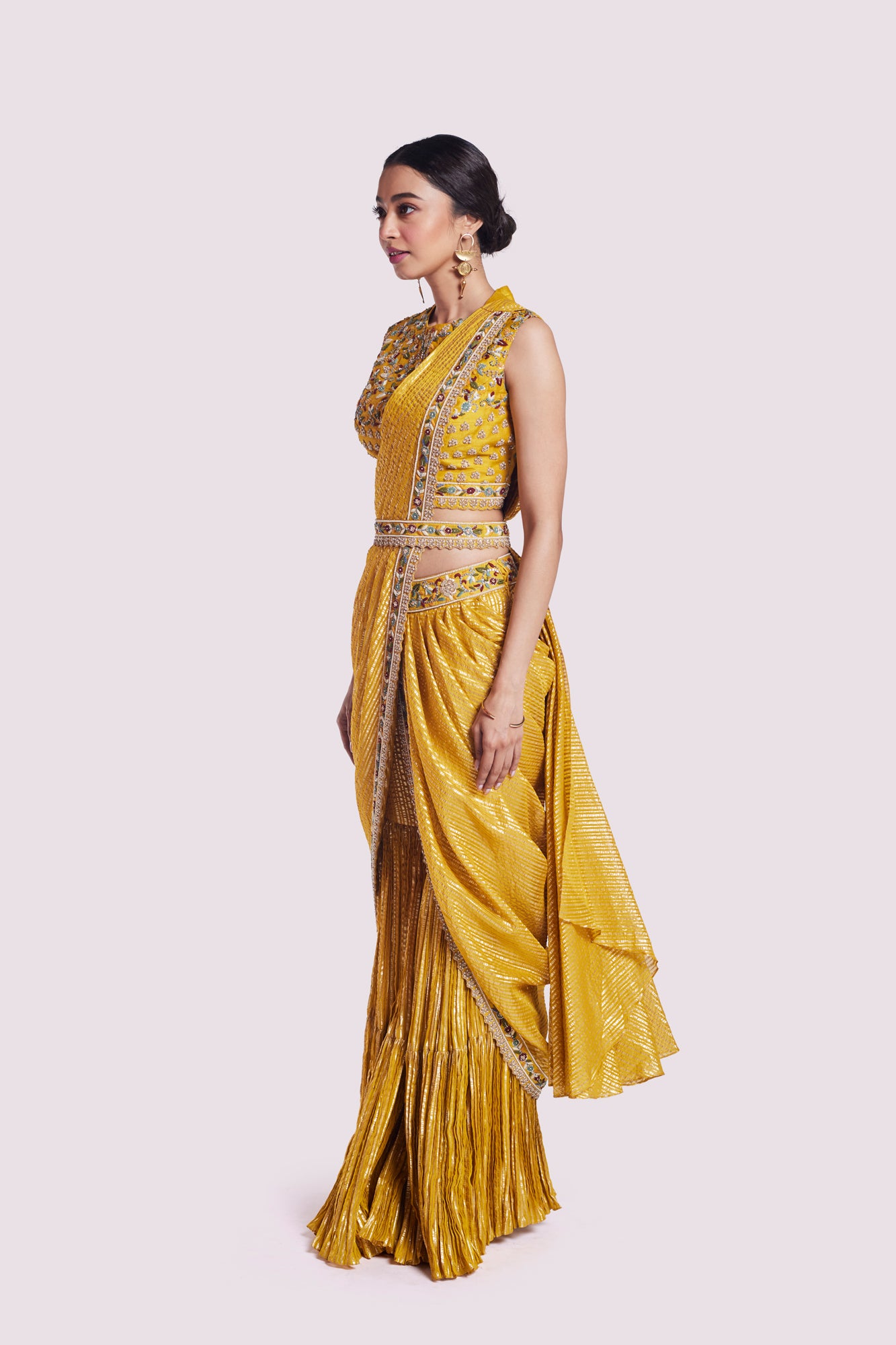 Buy mustard georgette draped saree online in USA with bustier blouse. Look your best at parties and weddings in beautiful designer sarees, embroidered sarees, handwoven sarees, silk sarees, organza saris from Pure Elegance Indian saree store in USA.-side