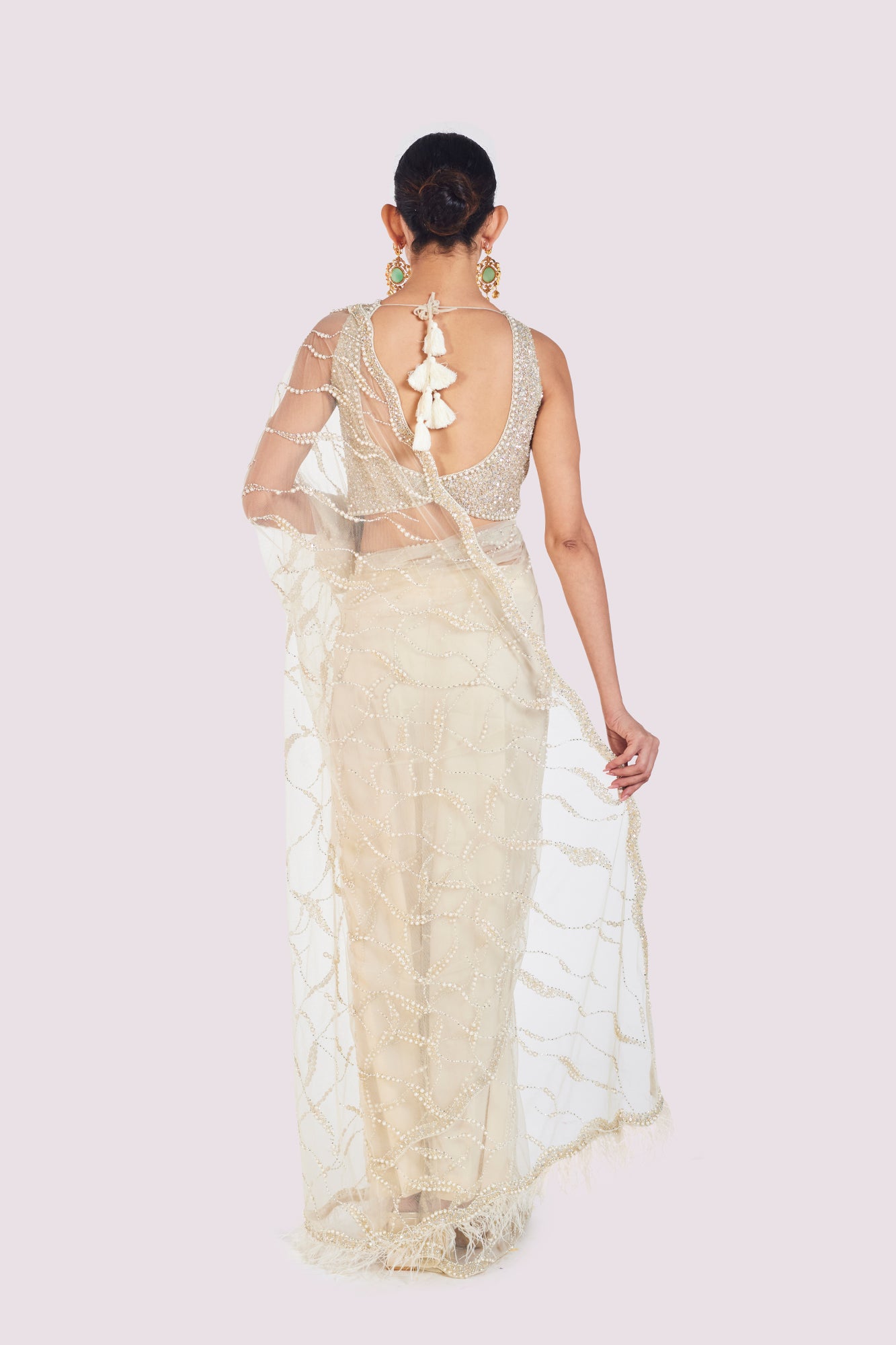 Shop beautiful ivory embroidered net saree online in USA with saree blouse. Look your best at parties and weddings in beautiful designer sarees, embroidered sarees, handwoven sarees, silk sarees, organza saris from Pure Elegance Indian saree store in USA.-back