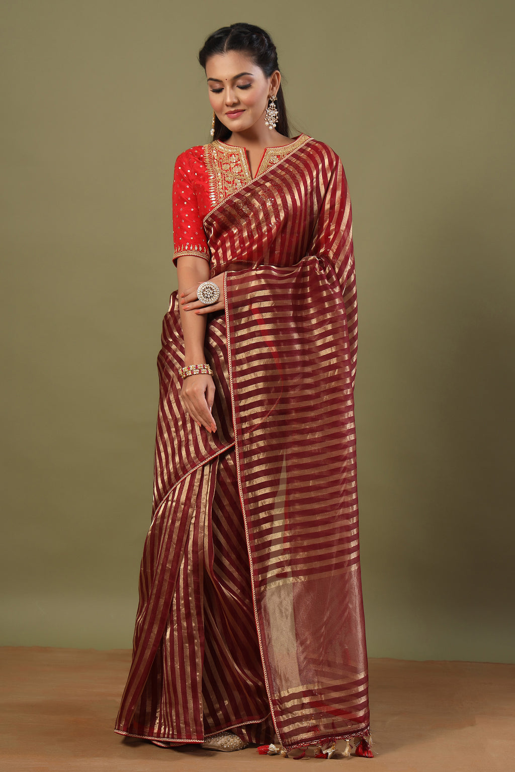 Buy maroon tissue chanderi saree online in USA with red saree blouse. Make a fashion statement at weddings with stunning designer sarees, embroidered sarees with blouse, wedding sarees, handloom sarees from Pure Elegance Indian fashion store in USA.-full view