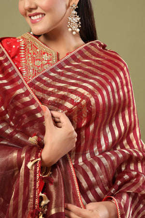 Buy maroon tissue chanderi saree online in USA with red saree blouse. Make a fashion statement at weddings with stunning designer sarees, embroidered sarees with blouse, wedding sarees, handloom sarees from Pure Elegance Indian fashion store in USA.-blouse