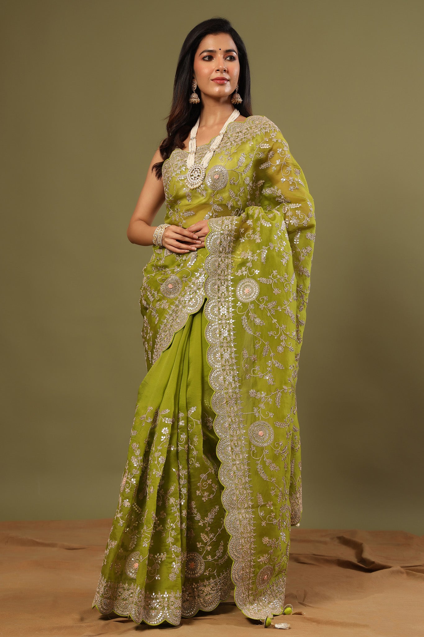 Buy beautiful olive green organza saree online in USA with embroidery. Make a fashion statement at weddings with stunning designer sarees, embroidered sarees with blouse, wedding sarees, handloom sarees from Pure Elegance Indian fashion store in USA.-saree