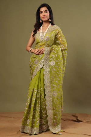 Buy beautiful olive green organza saree online in USA with embroidery. Make a fashion statement at weddings with stunning designer sarees, embroidered sarees with blouse, wedding sarees, handloom sarees from Pure Elegance Indian fashion store in USA.-front