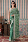 Shop green georgette Lucknowi sari online in USA with gota work border. Make a fashion statement at weddings with stunning designer sarees, embroidered sarees with blouse, wedding sarees, handloom sarees from Pure Elegance Indian fashion store in USA.-full view
