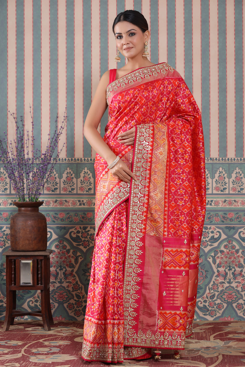 Shop pink and orange Patola silk sari online in USA with embroidered border. Make a fashion statement at weddings with stunning designer sarees, embroidered sarees with blouse, wedding sarees, handloom sarees from Pure Elegance Indian fashion store in USA.-full view