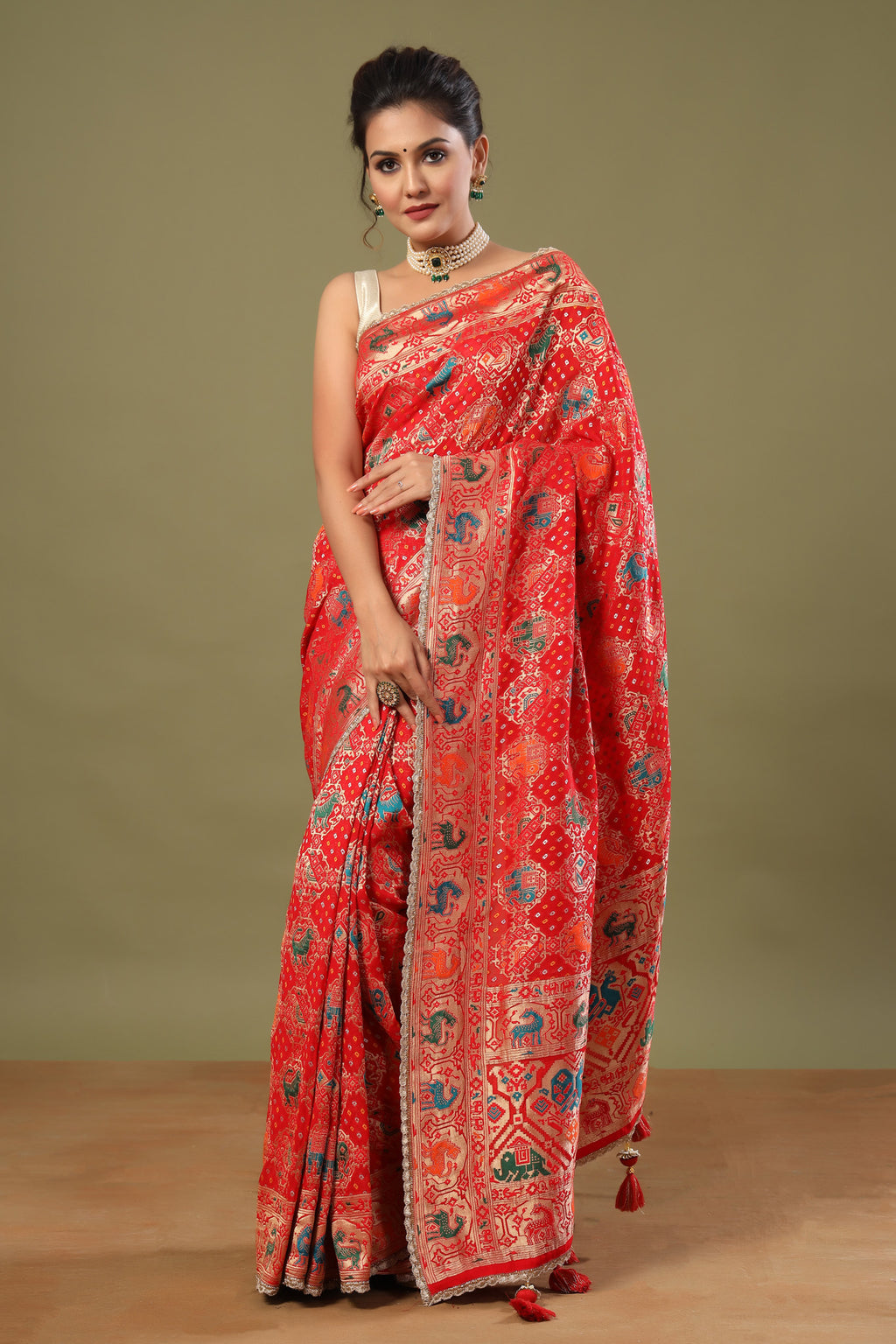 Shop red Patola silk saree online in USA with golden scalloped lace. Make a fashion statement at weddings with stunning designer sarees, embroidered sarees with blouse, wedding sarees, handloom sarees from Pure Elegance Indian fashion store in USA.-full view