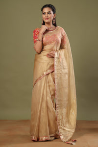 Buy golden tissue silk sari online in USA with pink embroidered blouse. Make a fashion statement at weddings with stunning designer sarees, embroidered sarees with blouse, wedding sarees, handloom sarees from Pure Elegance Indian fashion store in USA.-full view