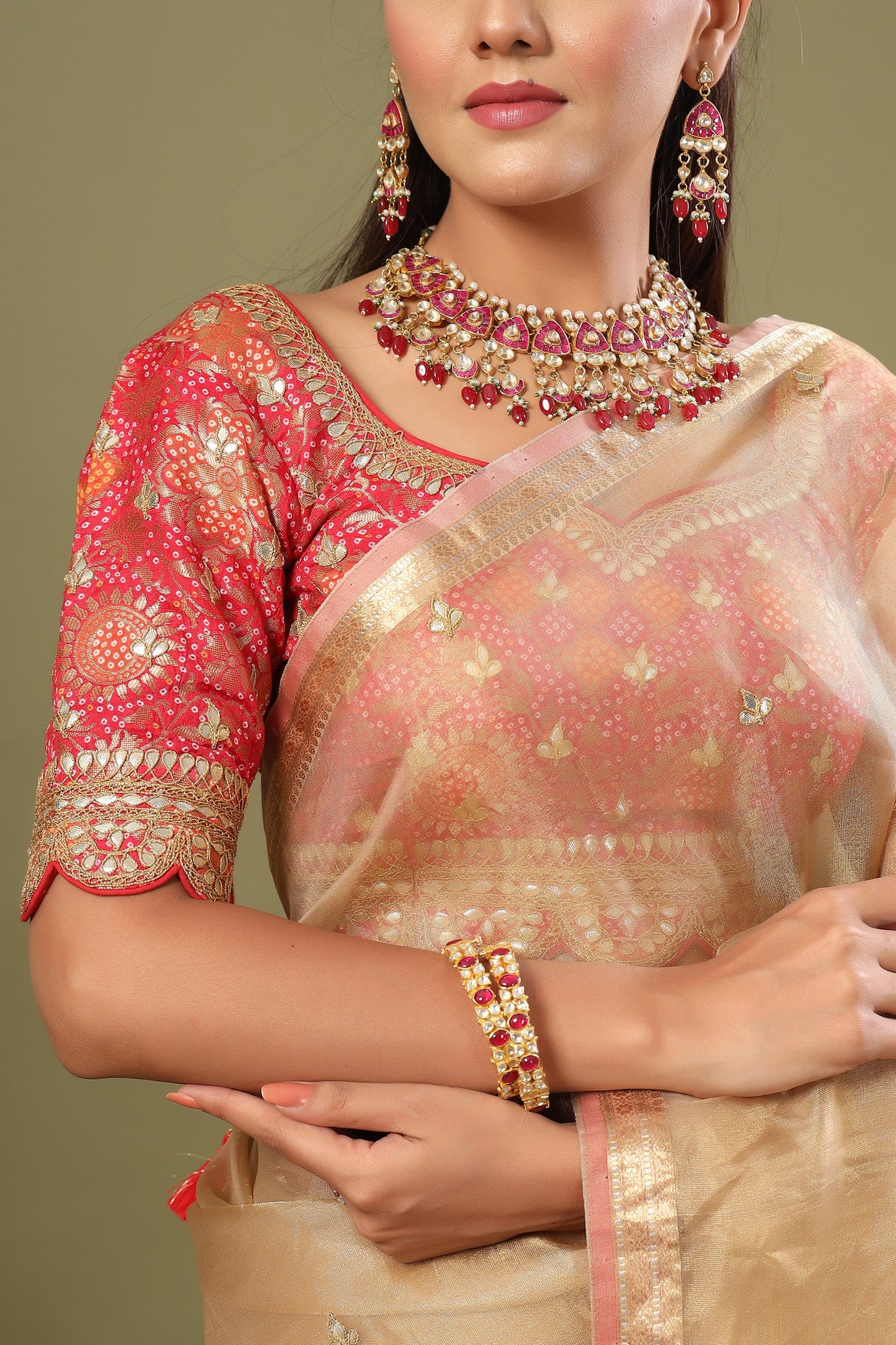 Buy golden tissue silk sari online in USA with pink embroidered blouse. Make a fashion statement at weddings with stunning designer sarees, embroidered sarees with blouse, wedding sarees, handloom sarees from Pure Elegance Indian fashion store in USA.-closeup