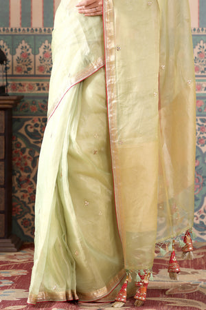 Shop beautiful pista green tissue silk saree online in USA with pink embroidered blouse. Make a fashion statement at weddings with stunning designer sarees, embroidered sarees with blouse, wedding sarees, handloom sarees from Pure Elegance Indian fashion store in USA.-pleats