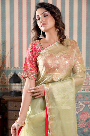 Shop beautiful pista green tissue silk saree online in USA with pink embroidered blouse. Make a fashion statement at weddings with stunning designer sarees, embroidered sarees with blouse, wedding sarees, handloom sarees from Pure Elegance Indian fashion store in USA.-closeup