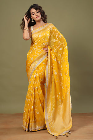 Buy yellow Banarasi saree online in USA with embroidered border. Make a fashion statement at weddings with stunning designer sarees, embroidered sarees with blouse, wedding sarees, handloom sarees from Pure Elegance Indian fashion store in USA.-front
