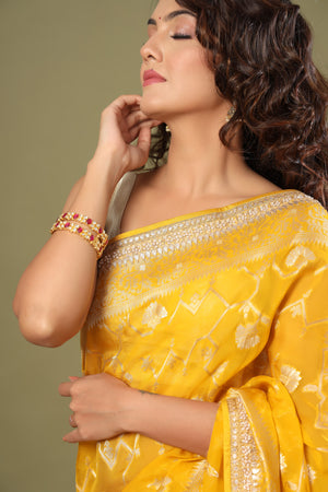 Buy yellow Banarasi saree online in USA with embroidered border. Make a fashion statement at weddings with stunning designer sarees, embroidered sarees with blouse, wedding sarees, handloom sarees from Pure Elegance Indian fashion store in USA.-details