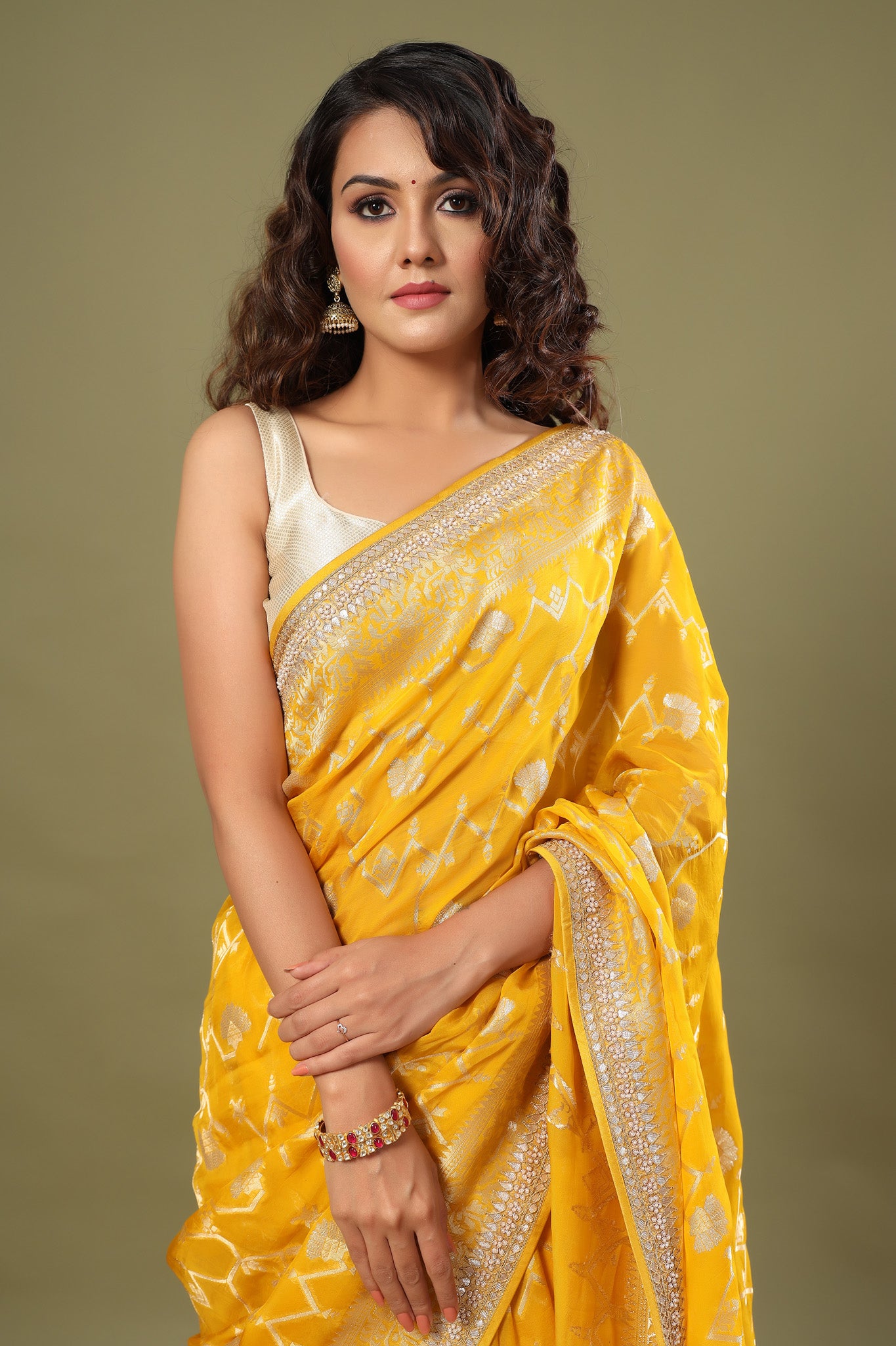 Buy yellow Banarasi saree online in USA with embroidered border. Make a fashion statement at weddings with stunning designer sarees, embroidered sarees with blouse, wedding sarees, handloom sarees from Pure Elegance Indian fashion store in USA.-closeup
