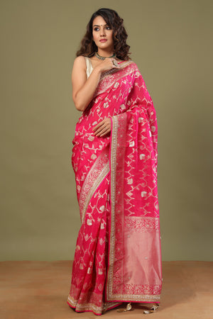 Shop bright pink Banarasi sari online in USA with embroidered border. Make a fashion statement at weddings with stunning designer sarees, embroidered sarees with blouse, wedding sarees, handloom sarees from Pure Elegance Indian fashion store in USA.-front