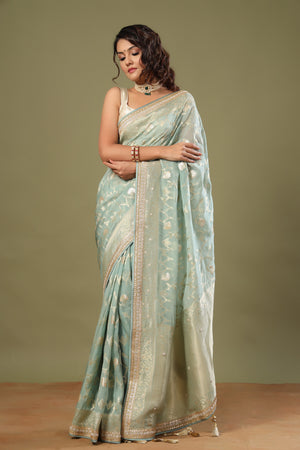 Shop mint green Banarasi saree online in USA with embroidered border. Make a fashion statement at weddings with stunning designer sarees, embroidered sarees with blouse, wedding sarees, handloom sarees from Pure Elegance Indian fashion store in USA.-front