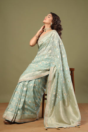 Shop mint green Banarasi saree online in USA with embroidered border. Make a fashion statement at weddings with stunning designer sarees, embroidered sarees with blouse, wedding sarees, handloom sarees from Pure Elegance Indian fashion store in USA.-pallu