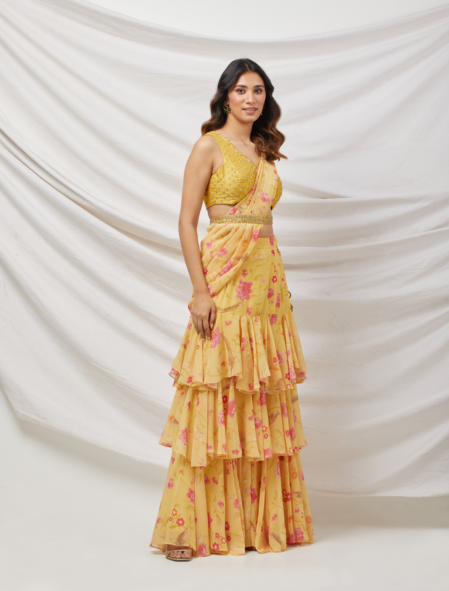 Buy yellow ruffle easy to drape saree set featuring sequins, cut dana, and zari work. Dazzle on weddings and special occasions with exquisite Indian designer dresses, sharara suits, Anarkali suits, and wedding lehengas from Pure Elegance Indian fashion store in the USA.