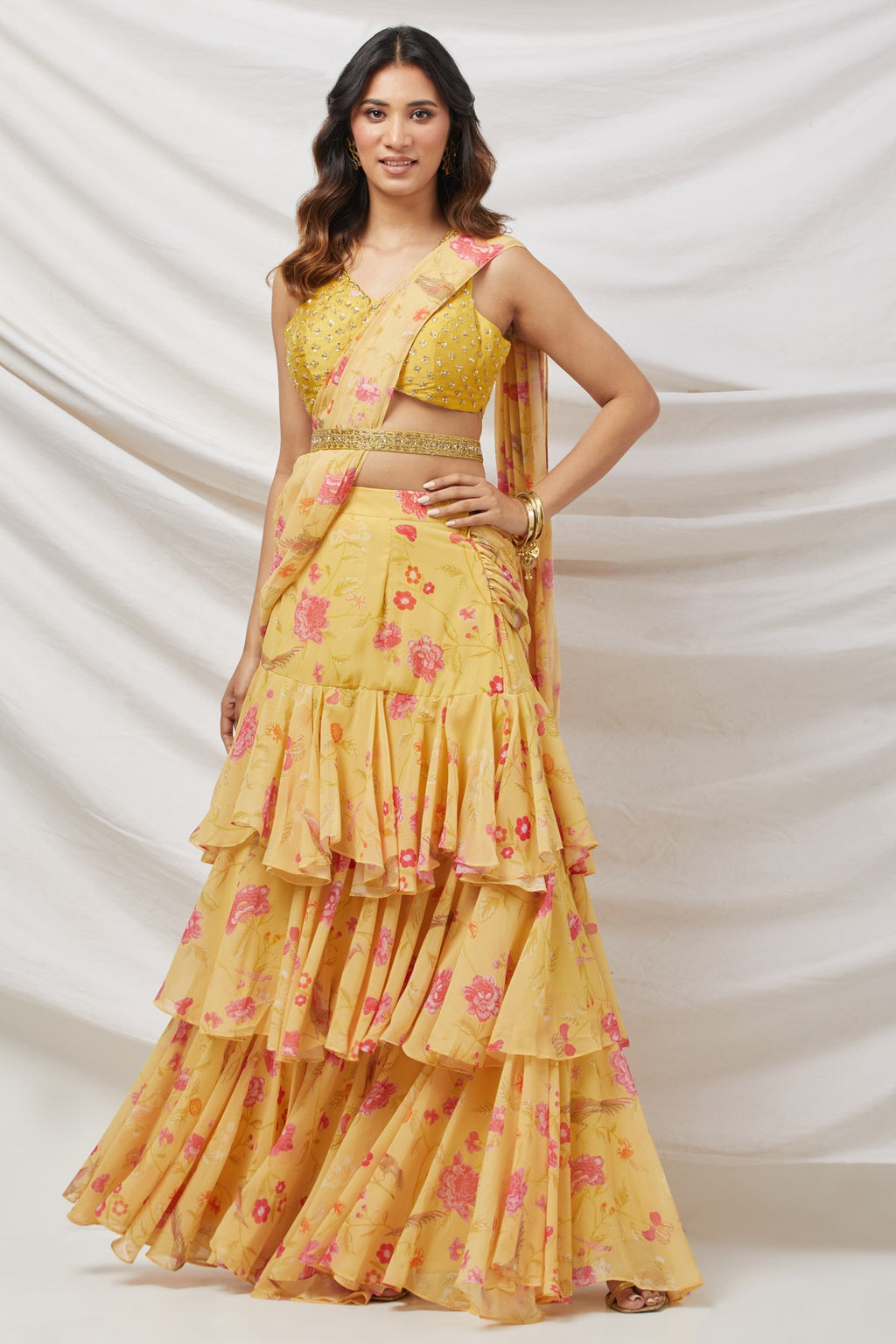 Buy yellow ruffle easy to drape saree set featuring sequins, cut dana, and zari work. Dazzle on weddings and special occasions with exquisite Indian designer dresses, sharara suits, Anarkali suits, and wedding lehengas from Pure Elegance Indian fashion store in the USA.
