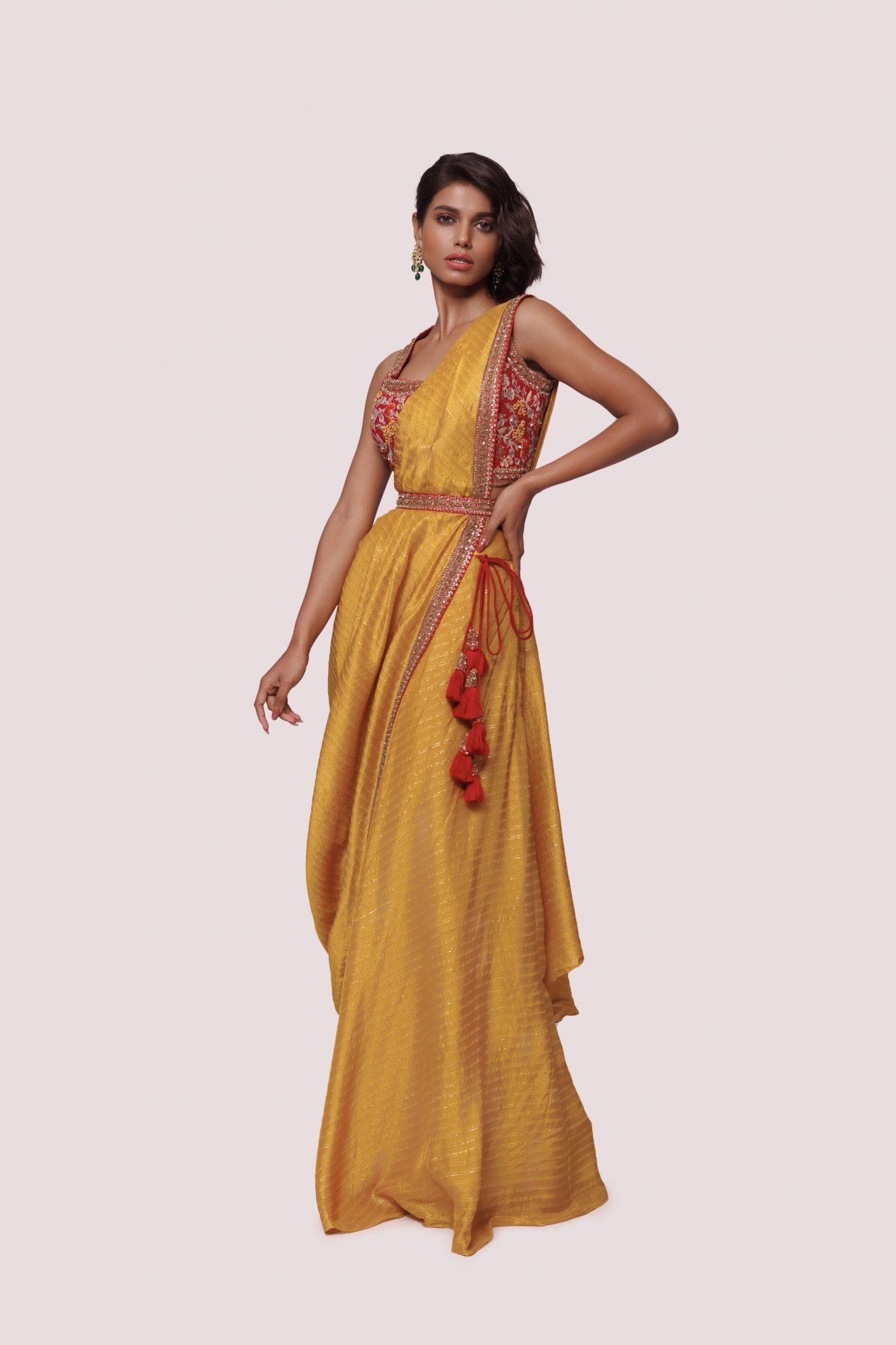 Shop mustard pre-stiched saree with thread embroidery. Make a fashion statement on festive occasions and weddings with designer sarees, designer suits, Indian dresses, Anarkali suits, palazzo suits, designer gowns, sharara suits, and embroidered sarees from Pure Elegance Indian fashion store in the USA.