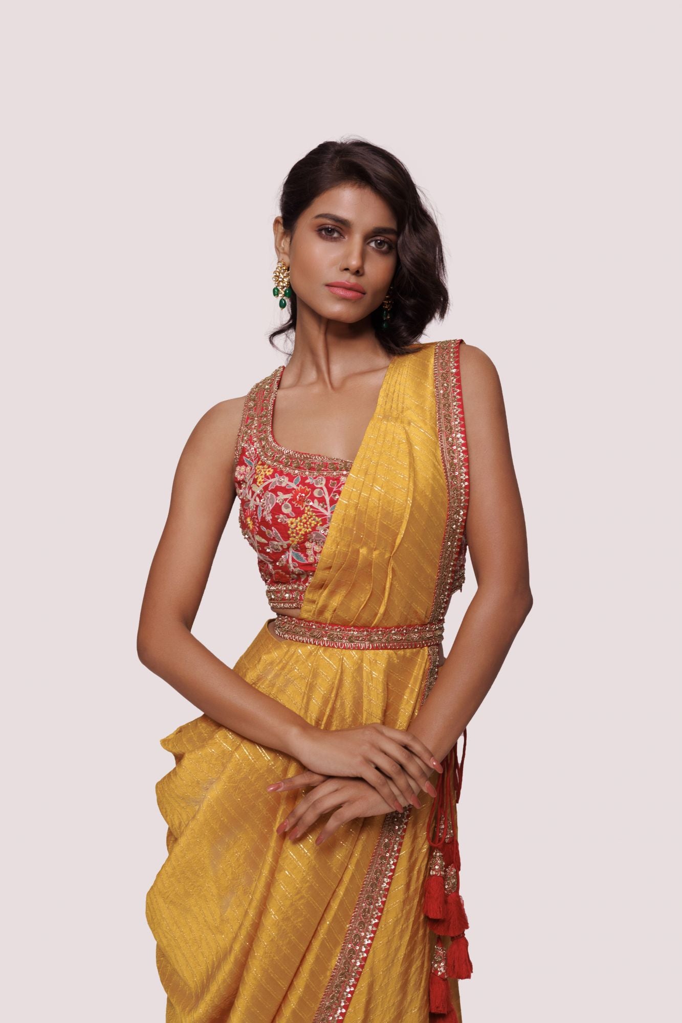 Shop mustard pre-stiched saree with thread embroidery. Make a fashion statement on festive occasions and weddings with designer sarees, designer suits, Indian dresses, Anarkali suits, palazzo suits, designer gowns, sharara suits, and embroidered sarees from Pure Elegance Indian fashion store in the USA.