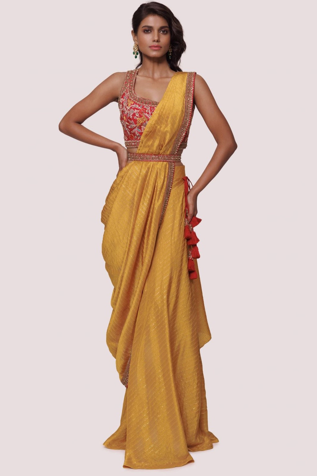 Shop mustard pre-stiched saree with thread embroidery. Make a fashion statement on festive occasions and weddings with designer sarees, designer suits, Indian dresses, Anarkali suits, palazzo suits, designer gowns, sharara suits, and embroidered sarees from Pure Elegance Indian fashion store in the USA.