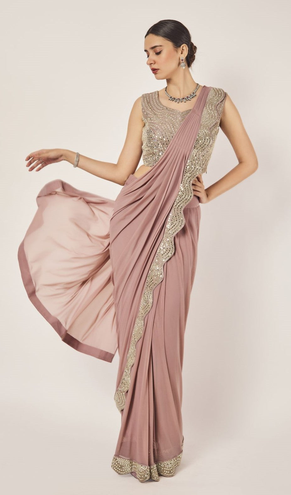 Shop peach drape saree set. Make a fashion statement on festive occasions and weddings with designer sarees, designer suits, Indian dresses, Anarkali suits, palazzo suits, designer gowns, sharara suits, and embroidered sarees from Pure Elegance Indian fashion store in the USA.