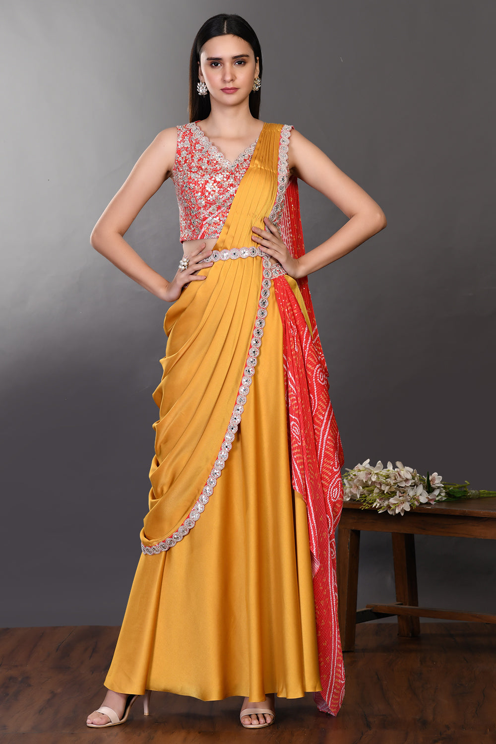Shop mustard and red drape saree with embroidered blouse and belt. Make a fashion statement on festive occasions and weddings with designer sarees, designer suits, Indian dresses, Anarkali suits, palazzo suits, designer gowns, sharara suits, and embroidered sarees from Pure Elegance Indian fashion store in the USA.