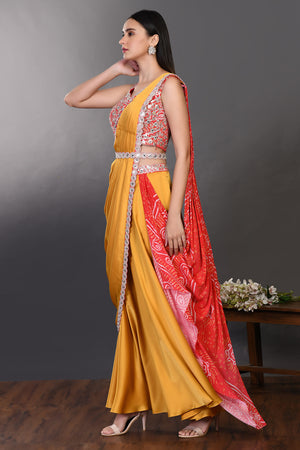 Shop mustard and red drape saree with embroidered blouse and belt. Make a fashion statement on festive occasions and weddings with designer sarees, designer suits, Indian dresses, Anarkali suits, palazzo suits, designer gowns, sharara suits, and embroidered sarees from Pure Elegance Indian fashion store in the USA.