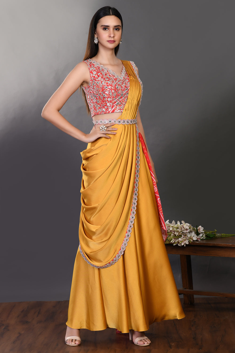 Shop mustard and red drape saree with embroidered blouse and belt. Make a fashion statement on festive occasions and weddings with designer sarees, designer suits, Indian dresses, Anarkali suits, palazzo suits, designer gowns, sharara suits, and embroidered sarees from Pure Elegance Indian fashion store in the USA.