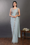 Shop a blue drape saree with embroidered blouse. Make a fashion statement on festive occasions and weddings with designer sarees, designer suits, Indian dresses, Anarkali suits, palazzo suits, designer gowns, sharara suits, and embroidered sarees from Pure Elegance Indian fashion store in the USA.